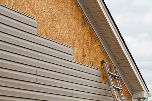 Professional Storm Damage Siding Repair technician working in Lewisville, NC